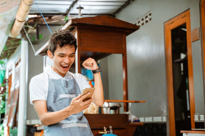 Portrait of young man working at home