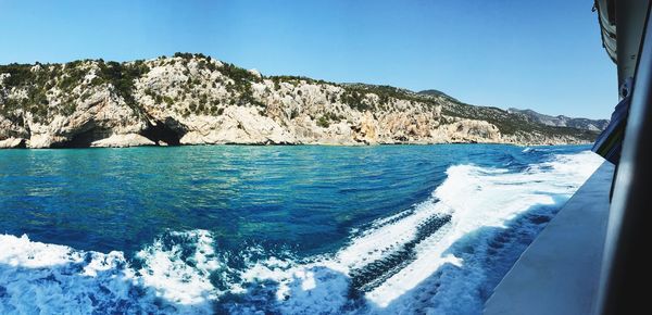 Scenic view of sea against clear blue sky