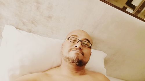 Portrait of young man lying down