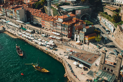 View of oporto downtown ribeira do porto from bridge d. luis over douro river. rebelo boats on it.