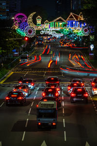Illuminated city street at night