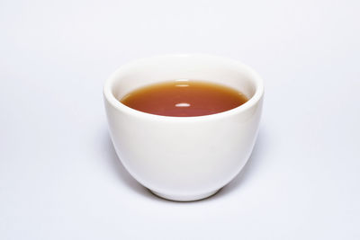 High angle view of tea cup against white background