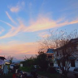 Built structures against sky at sunset