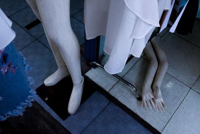 High angle view of mannequins on floor in clothing store