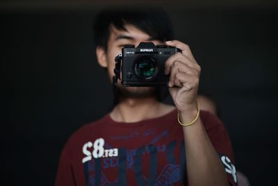 Portrait of woman photographing