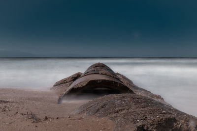 Abandoned scenic pipe by the sea