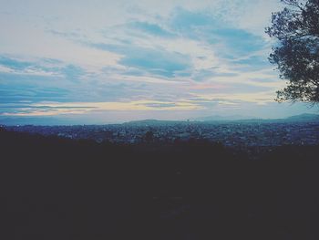 Scenic view of landscape against sky at sunset