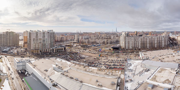 High angle view of city buildings against sky