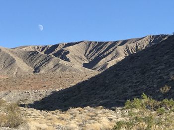 Scenic view of rocky mountains against clear blue sky