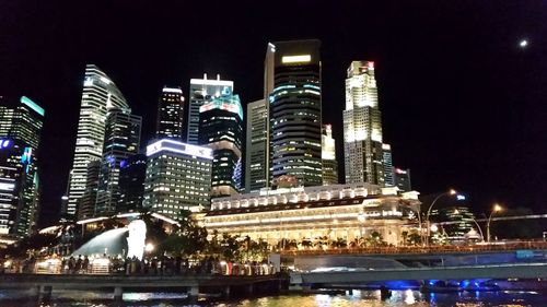 Low angle view of illuminated buildings at night
