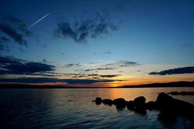 Scenic view of lake at sunset