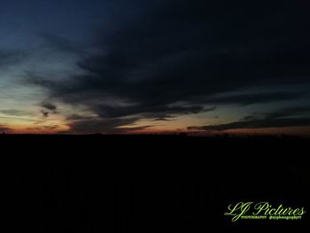 Scenic view of silhouette field against sky during sunset