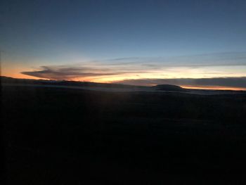 Scenic view of silhouette landscape against sky during sunset