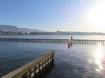 Pier on lake against sky