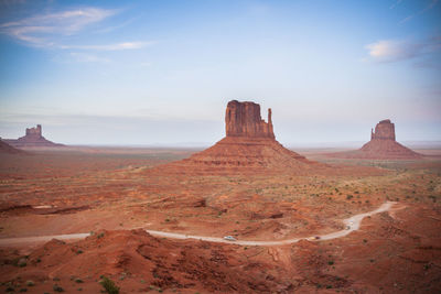 Rock formations on landscape against sky