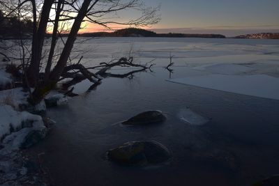 Scenic view of sea against sky at sunset