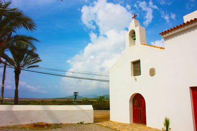 Low angle view of church and building against sky