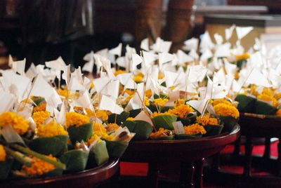 Close-up of religious offerings in temple