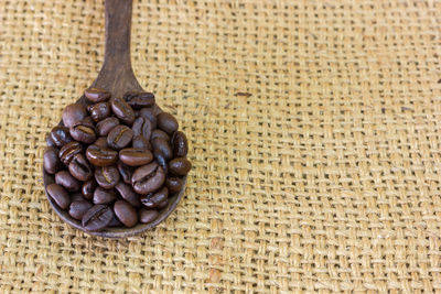 Close-up of coffee beans on table