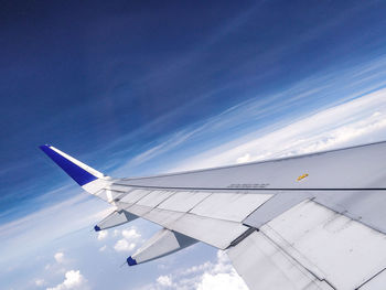 Low angle view of airplane flying in sky