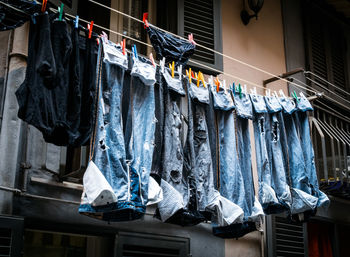Low angle view of clothes drying outside building