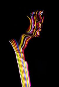 Close-up of light painting against black background
