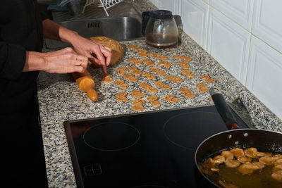 Midsection of man preparing food