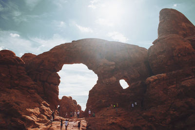 Low angle view of rock formation against sky