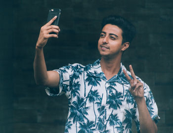 Young man using mobile phone