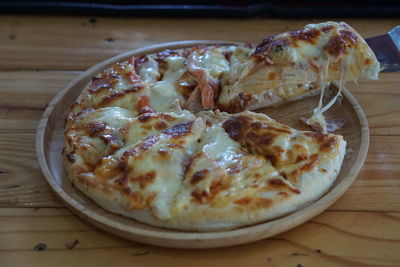 High angle view of pizza in plate on table