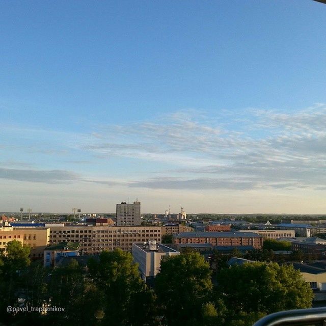 building exterior, architecture, built structure, city, cityscape, sky, tree, residential building, residential district, residential structure, high angle view, crowded, blue, city life, house, town, copy space, outdoors, cloud - sky, building