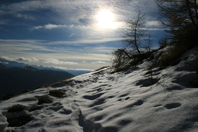 Scenic view of snow covered mountain against sky