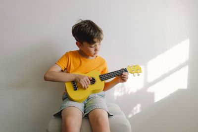 Boy playing guitar