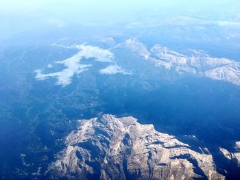 High angle view of mountains against blue sky