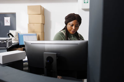 Young woman using laptop at home