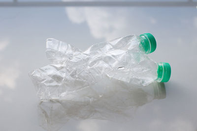 Close-up of water bottle against white background