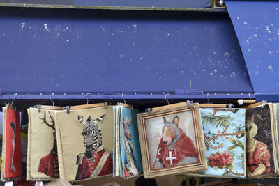 Colorful picture frames hanging for sale at market stall