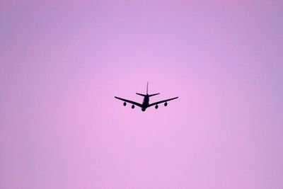 Low angle view of airplane against clear sky