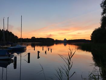 Scenic view of lake against sky during sunset