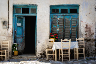 Empty chairs outside house