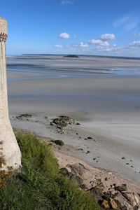 Cropped image of tower against beach