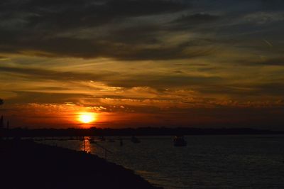 Scenic view of river during sunset