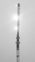 Low angle view of electricity pylon against sky