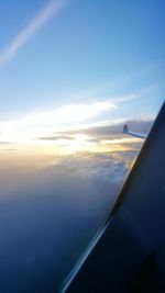 Aerial view of cloudscape seen through airplane window