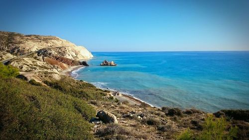 Scenic view of sea against blue sky