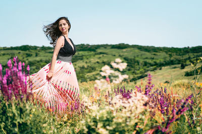 Young woman in wildflower field