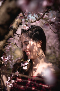 Portrait of woman with cherry blossoms