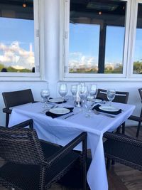 Empty chairs and tables in restaurant