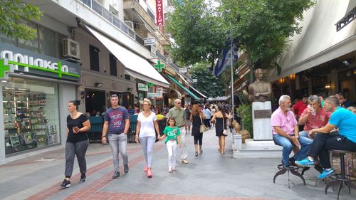 People walking on street in city