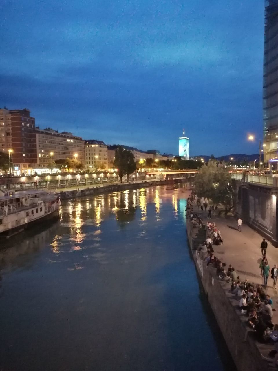 REFLECTION OF BUILDINGS IN RIVER